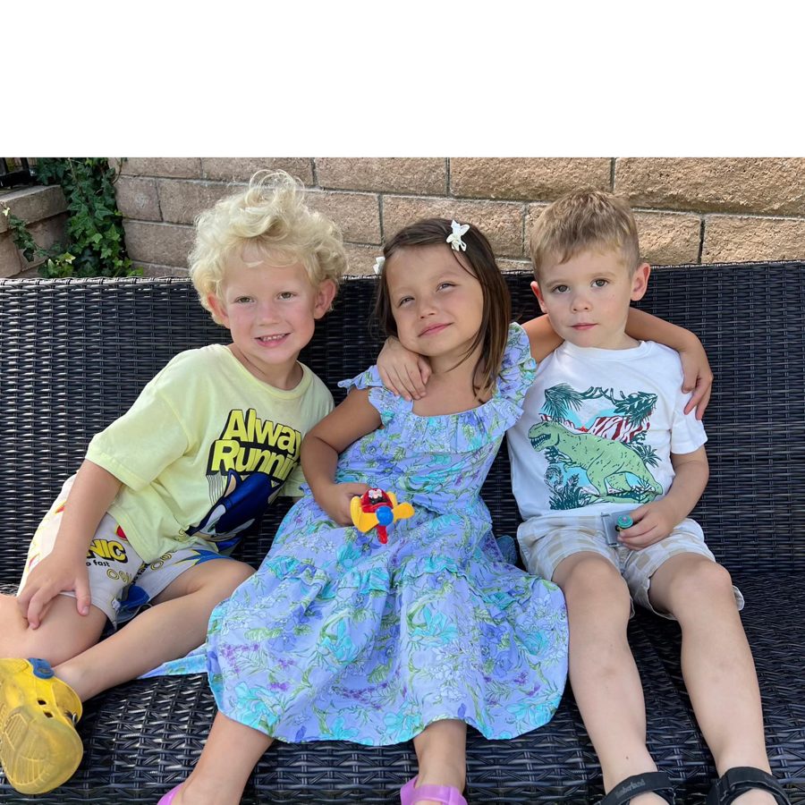 Children on a bench in the backyard