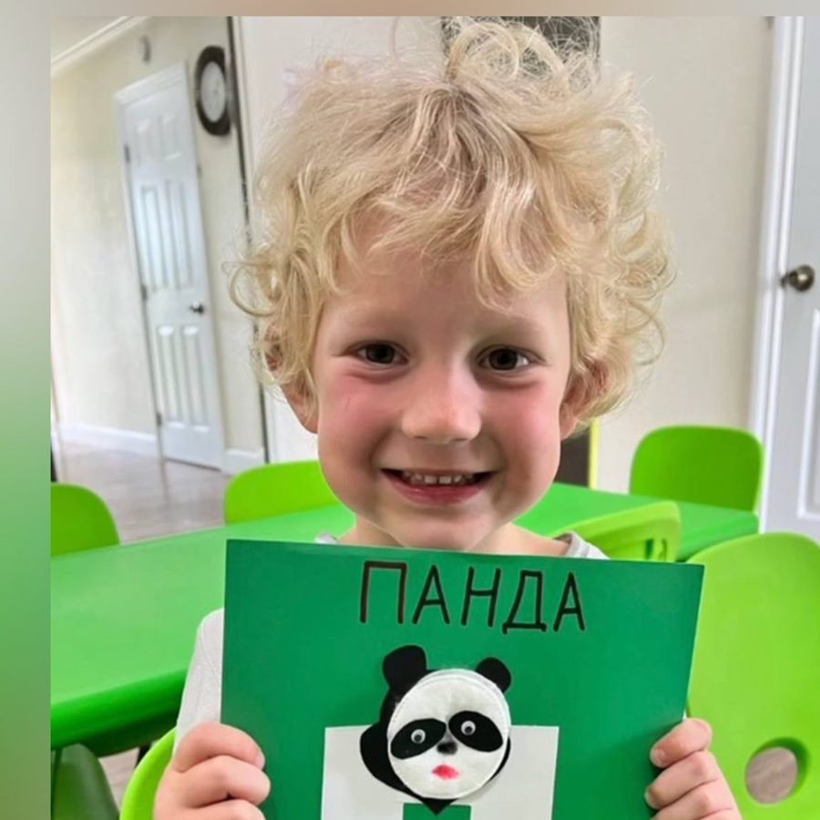 Boy holding a Panda sign