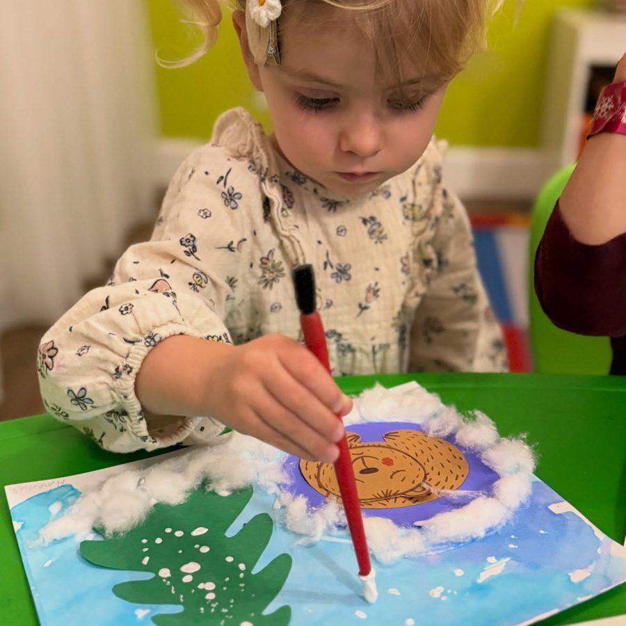 Girl painting a winter scene